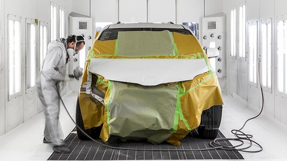 Collision Center Technician Painting a Vehicle | Kinderhook Toyota in Hudson NY