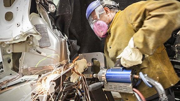 Collision Center Technician Repairing Vehicle | Kinderhook Toyota in Hudson NY