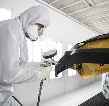 Collision Center Technician Painting a Vehicle | Kinderhook Toyota in Hudson NY